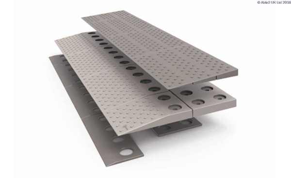 Non-slip aluminium transfer plates for mobility aid ramps and wheelchair accessibility.