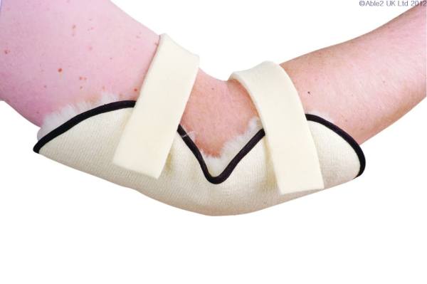 Bright pink wound with medical bandage and padding for mobility aid support.