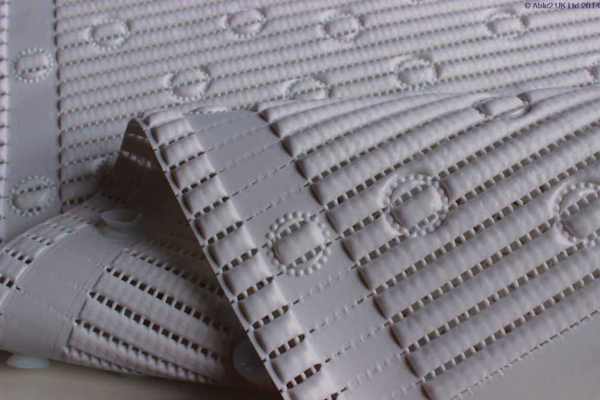 Adjustable white mobility ramp with anti-slip surface for accessible mobility solutions.