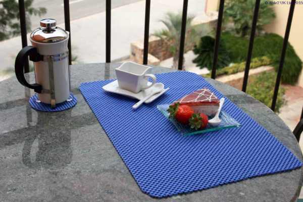 Stainless steel vacuum flask and breakfast set on a balcony table for mobility and independence.