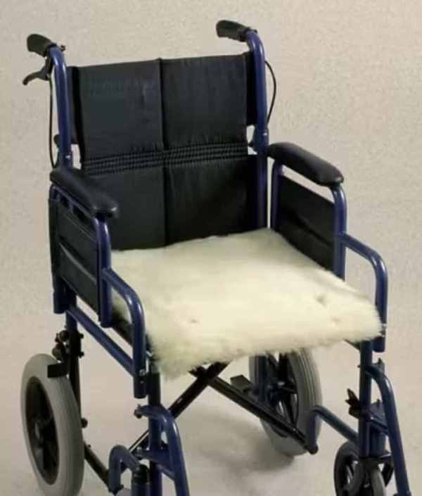 Lightweight folding wheelchair with plush seat and adjustable features for mobility assistance.
