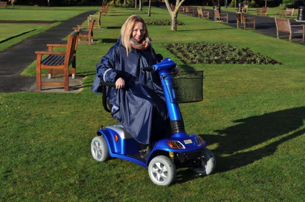 Electric mobility scooter for elderly outdoor use in park, accessible and easy to drive.