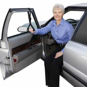 Comfortable senior woman using accessible vehicle with mobility aids for independence.
