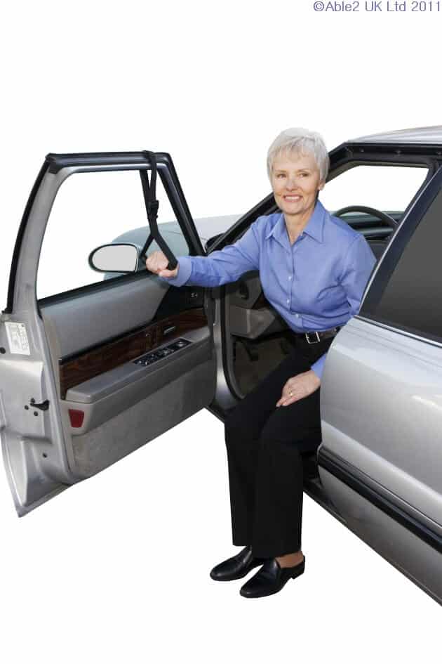 Comfortable senior woman using accessible vehicle with mobility aids for independence.