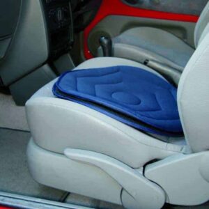 Non-slip wheelchair cushion on car seat for mobility support and comfort.