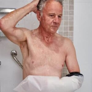 Limbo Waterproof Protectors - Adult Arm A man in shower using mobility aid support, showcasing accessible bathroom solutions.