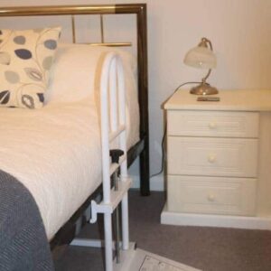 Adjustable bed with mobility aid for elderly comfort and independence in UK homes.