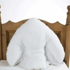 V' Pillow Pillowcase - White Soft pillow shaped like a person resting on a wooden bed headboard, offering comfort and support for better mobility and rest.