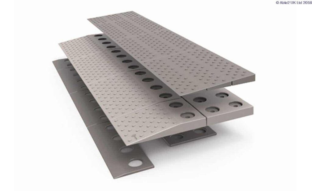 Non-slip aluminium transfer plates for mobility aid ramps and wheelchair accessibility.