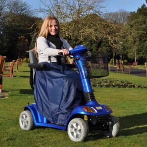 Splash Scooter Leg Cape - U Power mobility scooter for elderly and disabled individuals in a park setting.