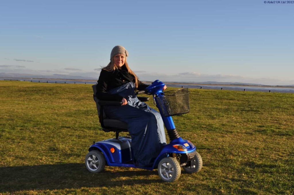 Comfortable mobility scooter for outdoor use in scenic countryside locations.