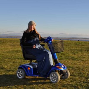 Splash Scooter Cosy - U Comfortable mobility scooter for outdoor use in scenic countryside locations.