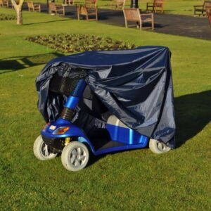 Electric mobility scooter covered with a rainproof cover for safe outdoor use.