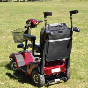 Electric mobility scooter with storage bag for elderly and disabled mobility assistance.