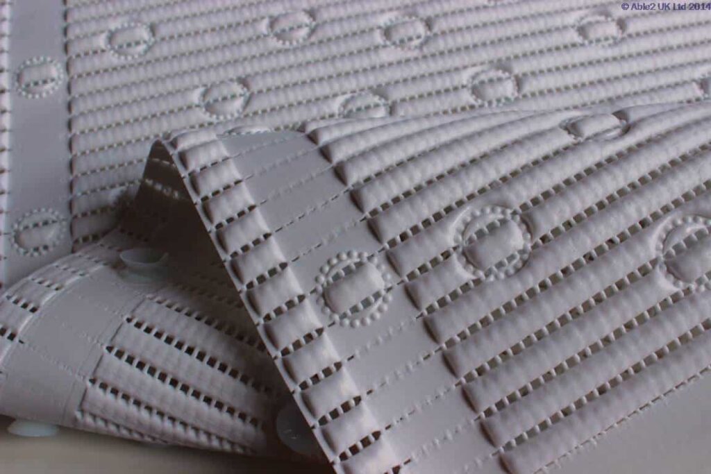 Adjustable white mobility ramp with anti-slip surface for accessible mobility solutions.