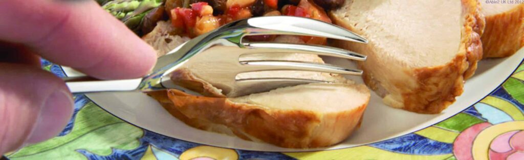 Delicious roasted chicken breast with crispy skin served on a colourful plate.