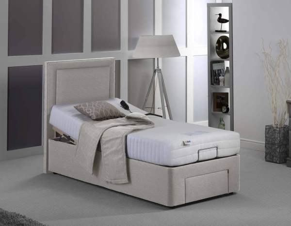 Comfortable adjustable hospital bed with remote control for easy positioning.