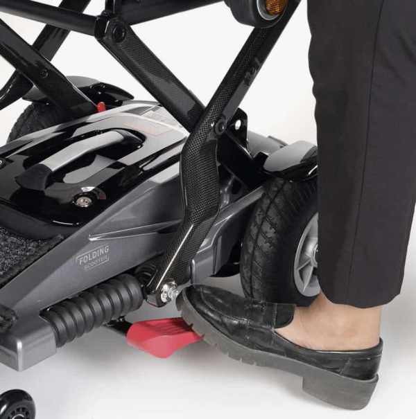 Electric mobility scooter with foldable design for easy transportation.