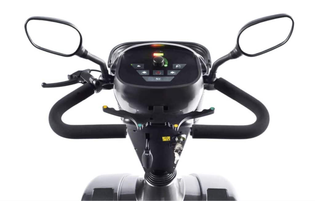 Electric mobility scooter dashboard with digital control panel and handlebars for accessible transport.